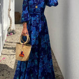 Ulla – Lång blomtrycksklänning med off-shoulder-ärmar